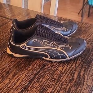 Black and gold slip on Puma